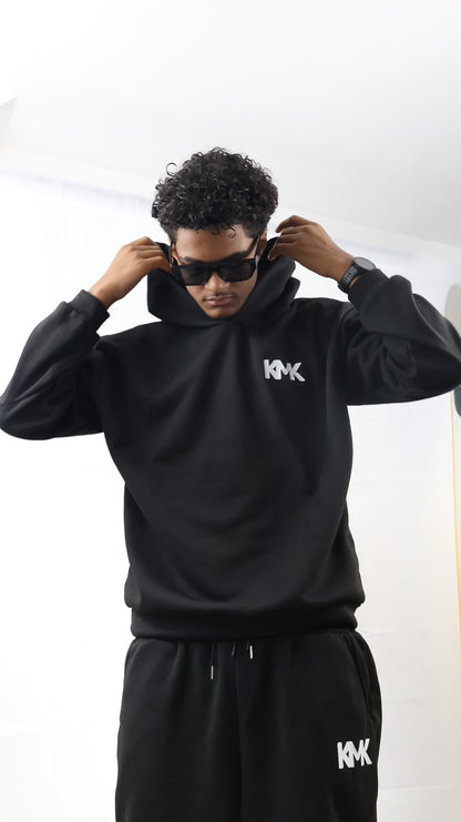 L'ensemble: Sweat à Capuche / Pantalon de Jogging.