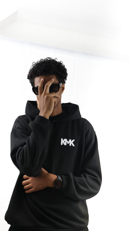 L'ensemble: Sweat à Capuche / Pantalon de Jogging.